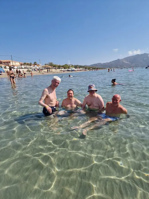 Four Spiral holidaymakers cooling off in the clear shallow sea at Salou