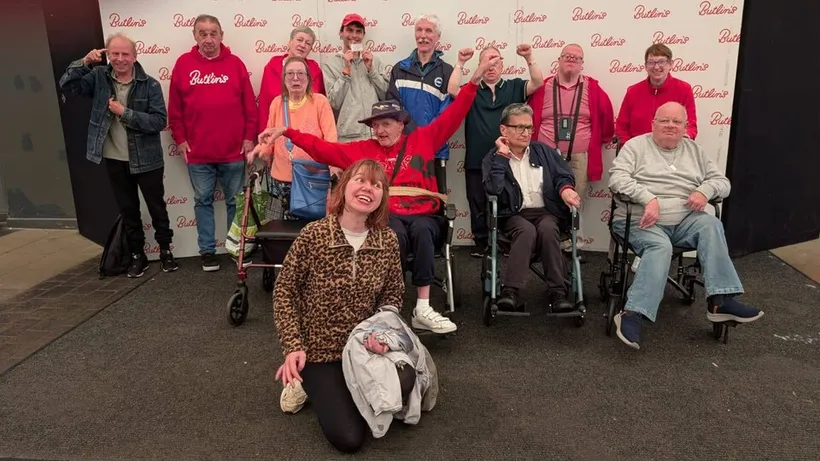 The Spiral group together in front of a Butlin's backdrop