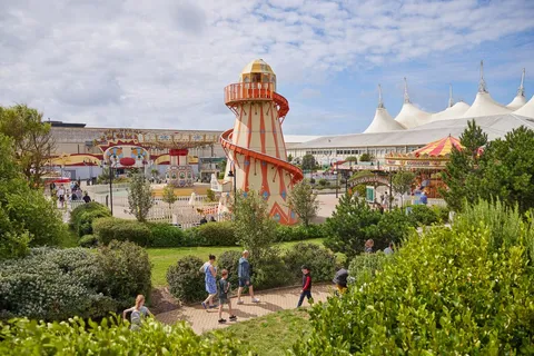 The Butlin's resort — helter skelter, fairground rides and gardens