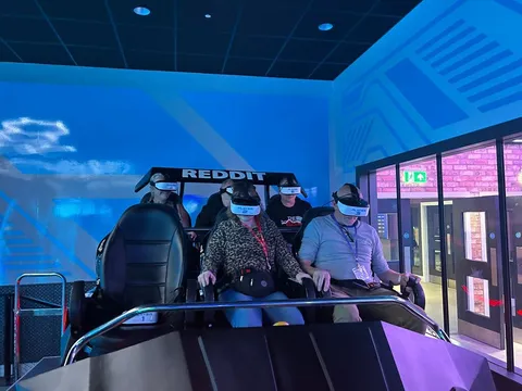 Spiral holidaymakers trying a virtual reality ride experience